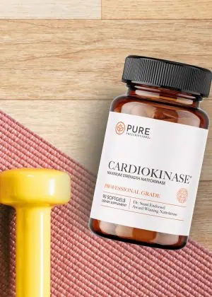 Flatlay of Cardiokinase with weights and a yoga mat.