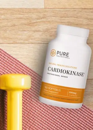 Flatlay of Cardiokinase with weights and a yoga mat.
