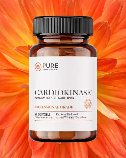 Bottle of Cardiokinase in front of an opened flower.