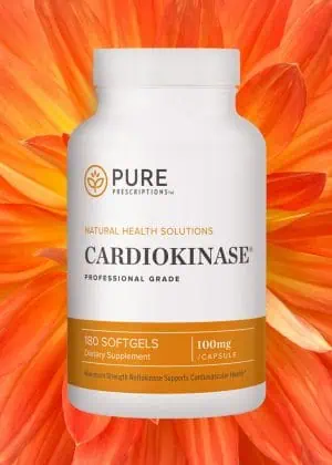 Bottle of Cardiokinase in front of an opened flower.