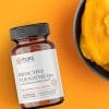 Bioactive CoEnzyme Q10 flatlay beside a bowl of mangoes
