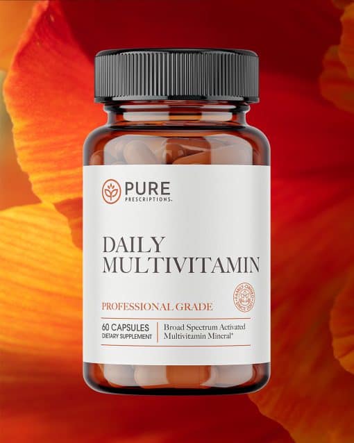 Bottle of Daily Multivitamin against a flower.