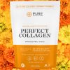 Perfect Collagen pouch against a bed of flowers.