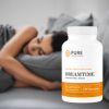 Woman sleeping on a relaxing grey pillow next to a bottle of Dreamtime Supplements by Pure Prescriptions