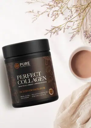 Cocoa Flavored Perfect Collagen beside a cup of coffee.