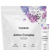 Thorne Amino Complex (30 Berry Stick Packs) - NSF Certified EAA and BCAA powder for muscle recovery and performance.