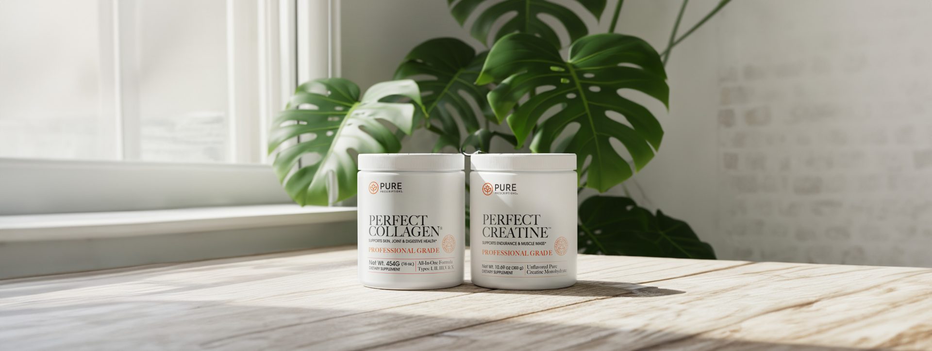 Perfect Collagen and Perfect Creatine canisters sitting on a table with sunshine coming in through the window.